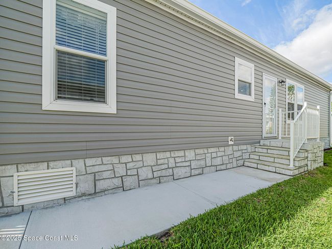 623 Hyacinth Cir, House other with 3 bedrooms, 2 bathrooms and null parking in Barefoot Bay FL | Image 41
