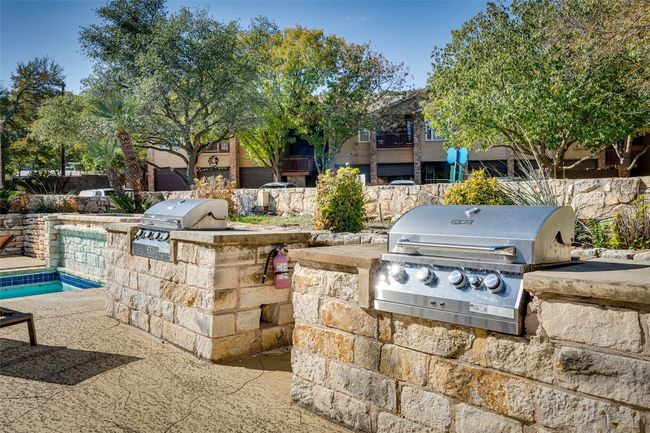 View of patio / terrace with area for grilling, a grill, and a pool | Image 23