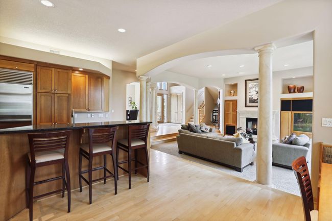 High ceilings w/ welcoming, open floor plan and curved walkways. Large windows throughout make this home light and bright! | Image 17