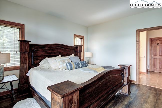 The door beyond leads to the primary suite bath. | Image 32
