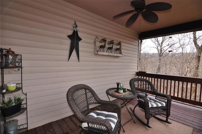 A cozy covered deck off of kitchen to enjoy coffee in the morning or beverage in the evening. | Image 16