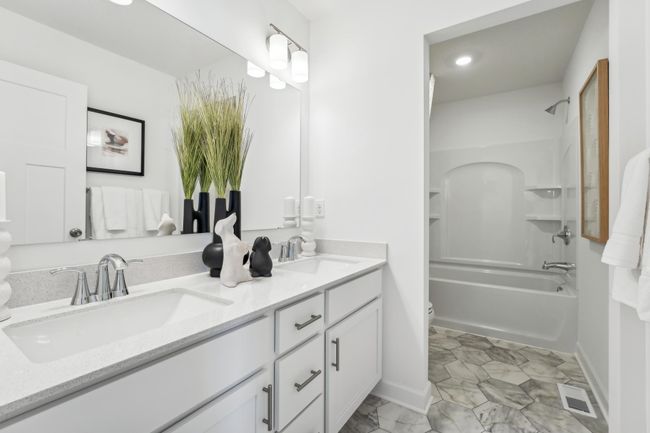 Photo is of the actual model. The secondary bath on the upper level provides the perfect amount of space! | Image 27