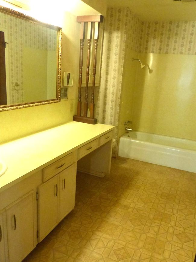 Master bath featuring a spacious layout, dual vanities, and a serene atmosphere—designed for both comfort and style. | Image 12