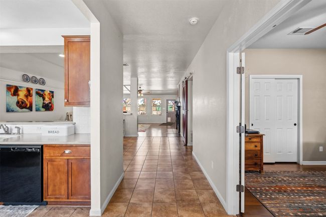 Front hallway with kitchen to the left and flex room/home office or 4th bedroom to the right. | Image 12