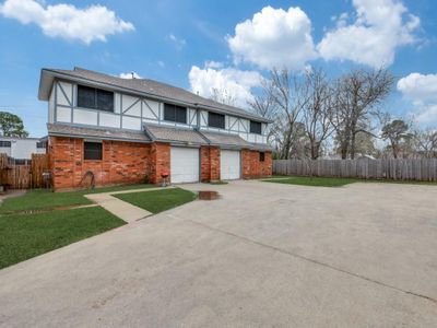 View of front facade featuring a garage and a front yard | Image 2