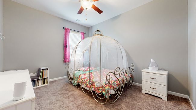 Secondary bedroom with view of back field | Image 32