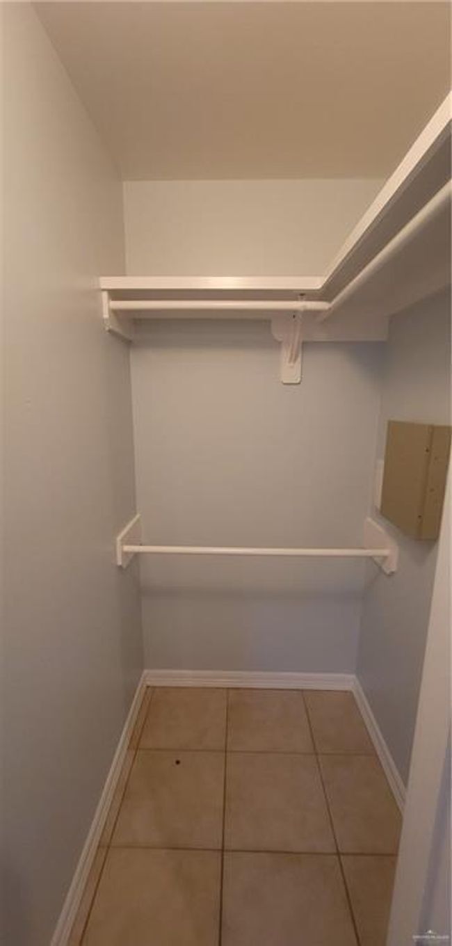 Spacious closet with tile patterned floors | Image 4