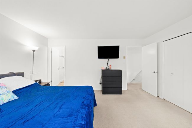 Bedroom with a closet and light colored carpet | Image 20