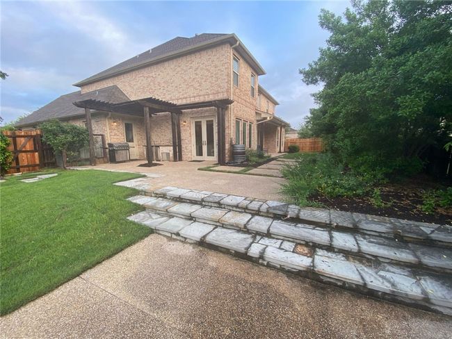 Rear view of property with french doors, a patio area, brick siding, and a pergola | Image 4