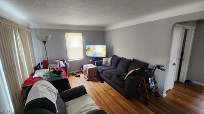 Living room featuring wood-type flooring | Image 3