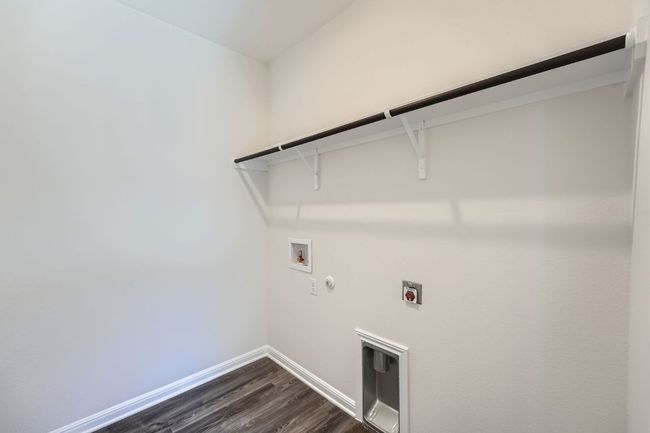 Laundry room with baseboards, gas dryer hookup, laundry area, hookup for a washing machine, and electric dryer hookup | Image 23