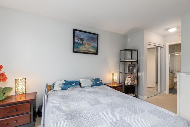 Bedroom featuring light colored carpet, baseboards, and a closet | Image 20