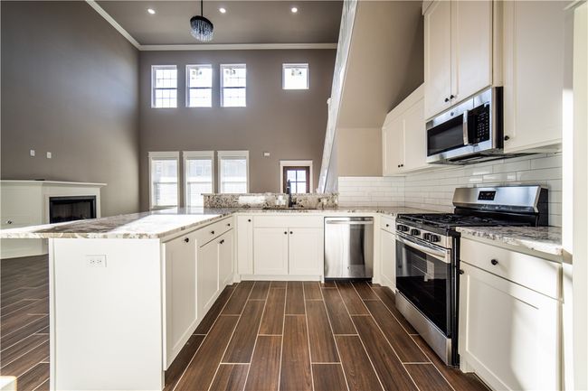 Kitchen is open to living area | Image 13