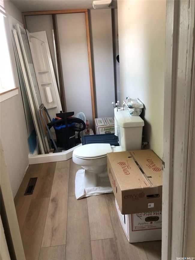 Bathroom with toilet and wood finished floors | Image 37