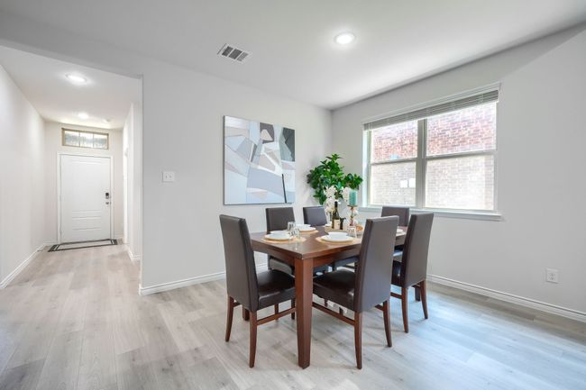Dining room featuring light wood finished floors, recessed lighting, and baseboards | Image 5