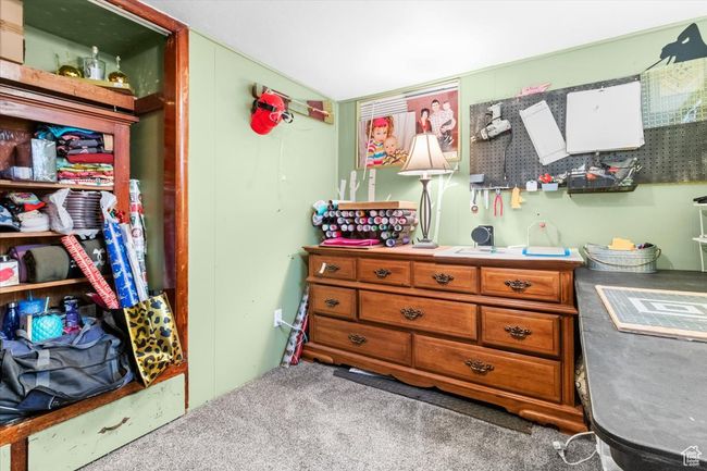Bedroom featuring carpet flooring and lofted ceiling | Image 39