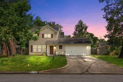 Welcome home to 17534 South Compass Rose Circle located on a quiet street in Newport and zoned to Crosby ISD! This stunning home has lovely curb appeal, a well-manicured lawn, beautiful landscaping, dark front door, covered front porch, traditional style, shutters, beautiful outdoor lanterns and a double wide driveway! | Image 1