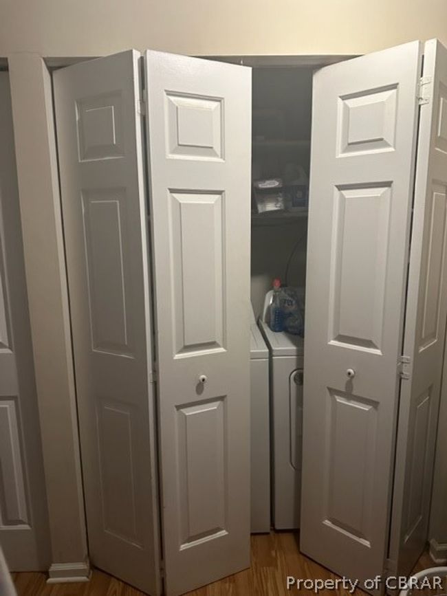 Details featuring washing machine and dryer and hardwood / wood-style floors | Image 18