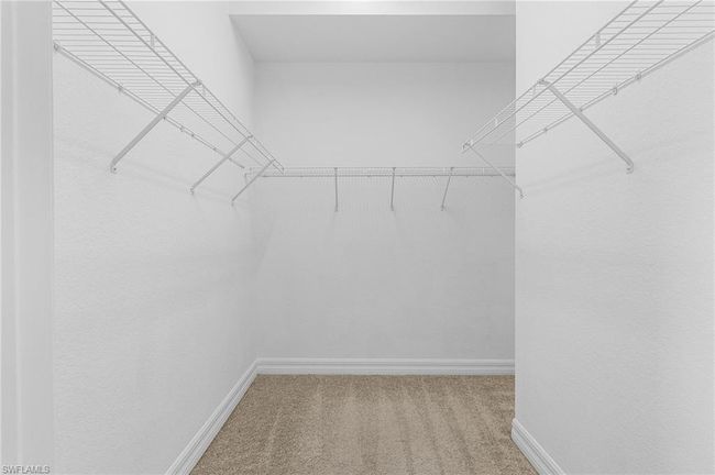 Spacious closet with carpet | Image 23