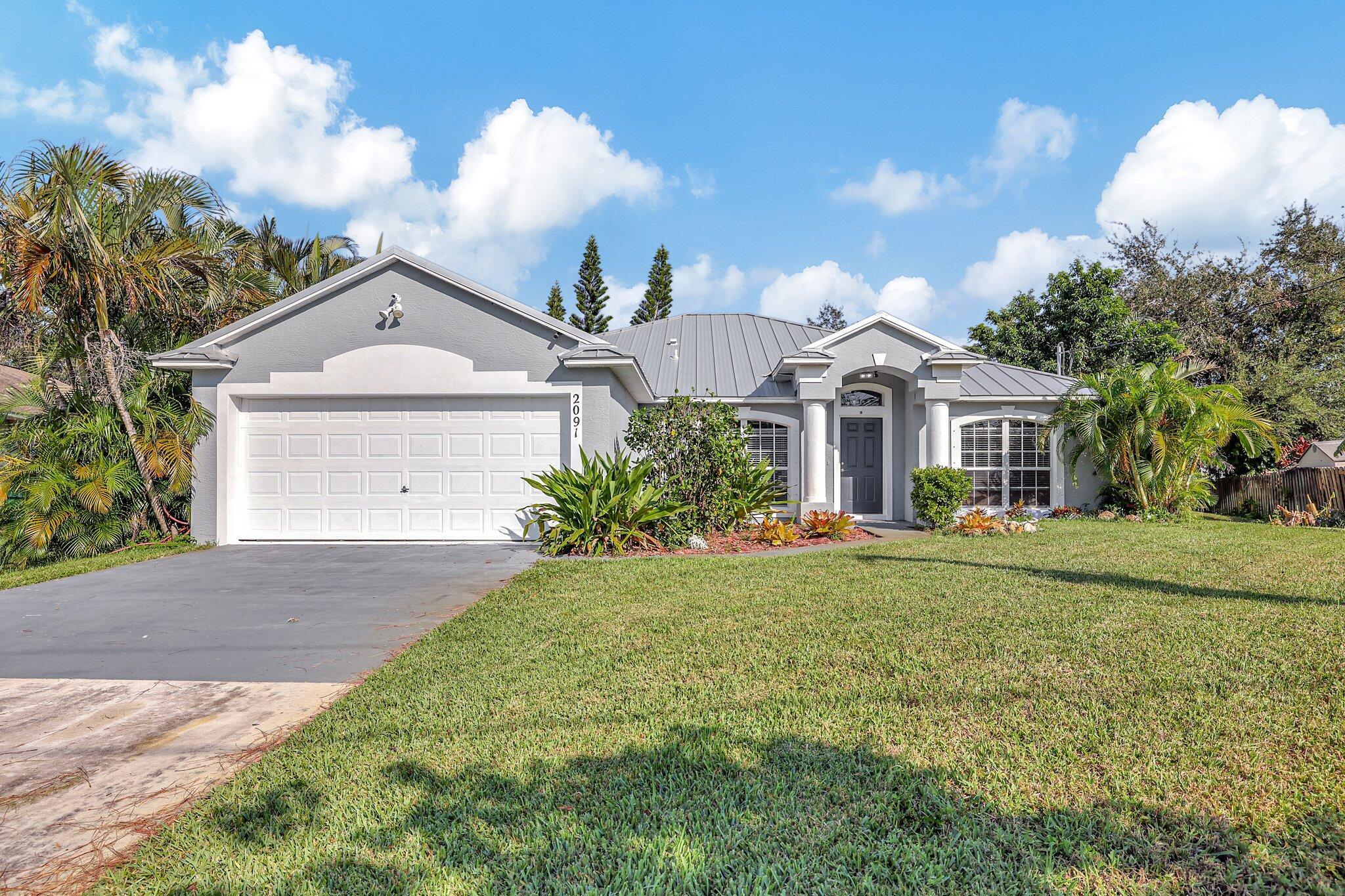 2091 Sw Bellevue Avenue, For Sale in Port St. Lucie Zoocasa