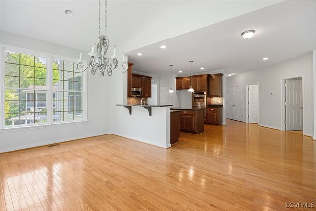 recessed lighting, a notable chandelier, Morning room, light wood-style flooring, and baseboards | Image 18