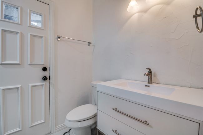 Bathroom featuring vanity and toilet | Image 21