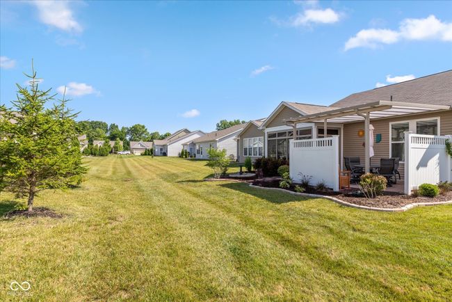 view of yard with a patio area and a 3 season sunroom | Image 6