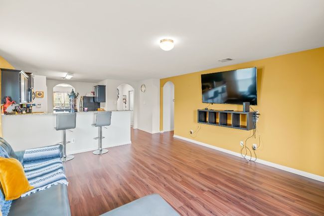 Living room with dark wood-type flooring | Image 10