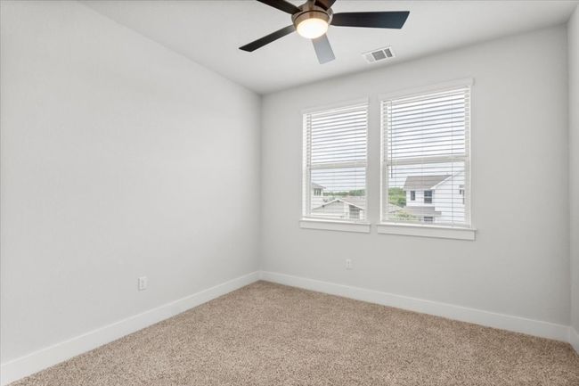 Spare room with light carpet and a ceiling fan | Image 21