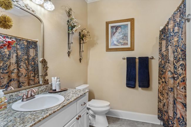Full bath with toilet, vanity, tile patterned floors, and baseboards | Image 17