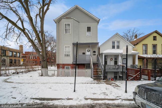 8854 S Buffalo Avenue, Home with 9 bedrooms, 3 bathrooms and 2 parking in Chicago IL | Image 1