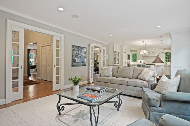 Glass sliders in the family room provide separation without sacrificing light. | Image 9