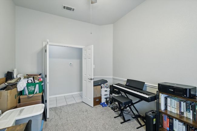 Carpeted office space featuring visible vents and tile patterned floors | Image 11