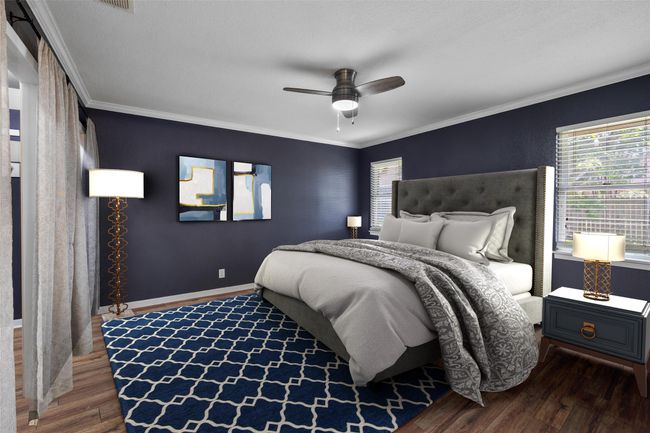 Bedroom featuring dark wood-style floors, crown molding, baseboards, and a ceiling fan | Image 11