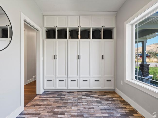 Mudroom with brick floors and baseboards | Image 20