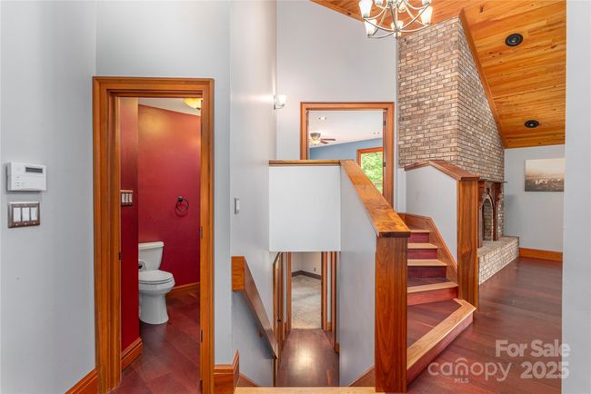Stairs to primary suite and lower level rooms | Image 5