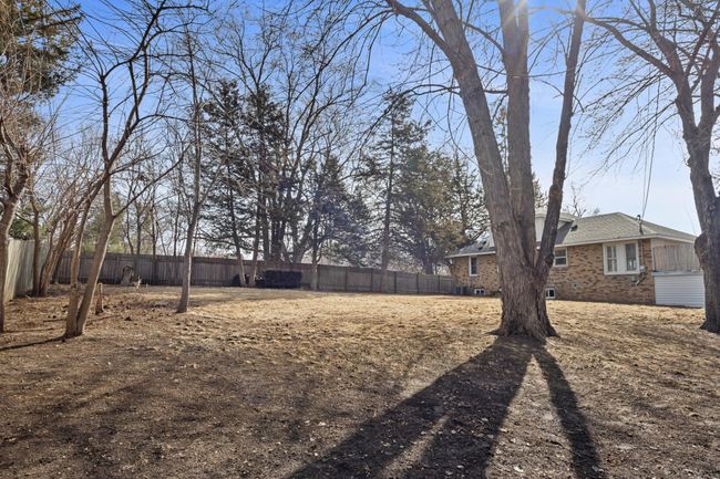 .42 acres of a fully fenced in backyard | Image 4
