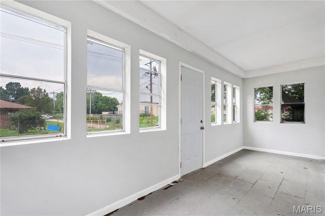 Unfurnished sunroom featuring plenty of natural light | Image 5