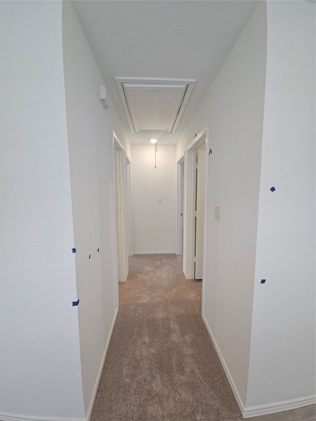 Hallway featuring attic access and carpet flooring | Image 13