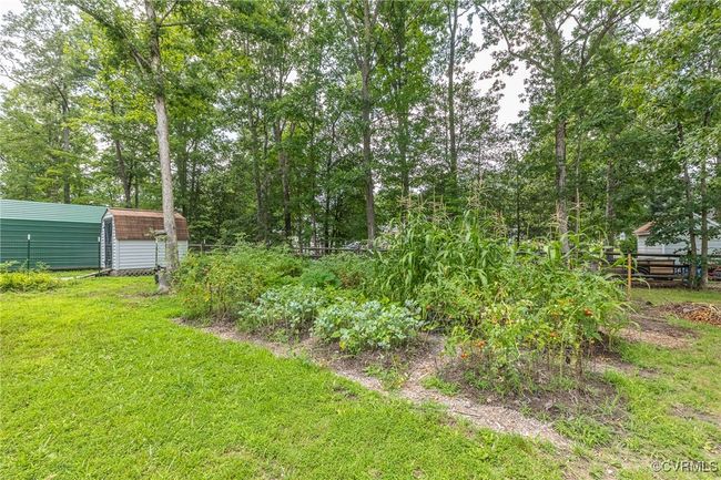 View of yard with a storage shed | Image 40