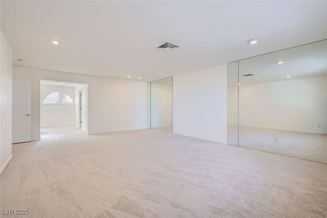 Spare room featuring carpet floors, visible vents, and recessed lighting | Image 37