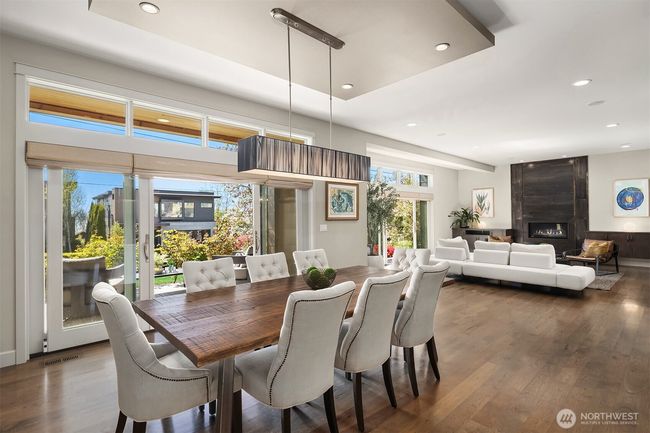 The thoughtfully designed main floor features an open, flowing layout ideal for entertaining, with generous gathering spaces that transition effortlessly to both the front and back yards—perfect for indoor-outdoor living. | Image 5