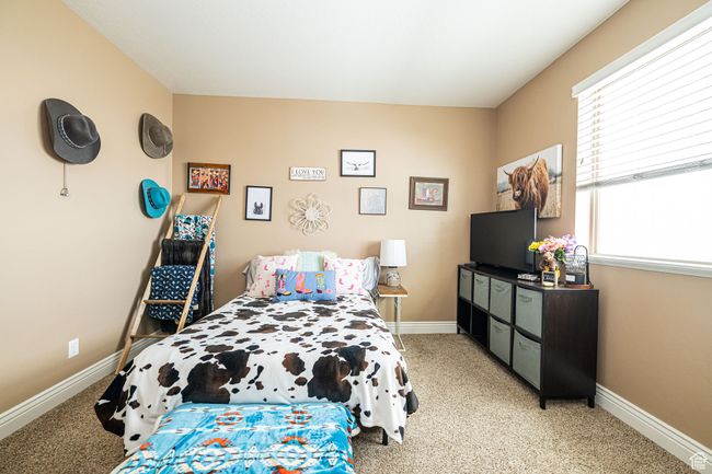 Bedroom featuring baseboards and light colored carpet | Image 14