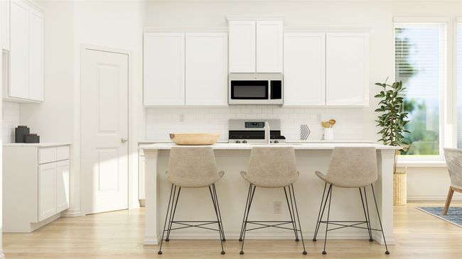 Kitchen with white microwave, range with electric stovetop, an island with sink, and decorative backsplash | Image 11