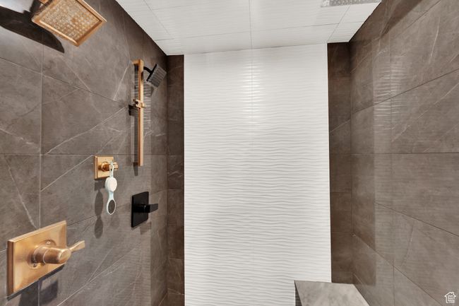 Bathroom view of a tile shower | Image 19