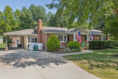 Single story home featuring a carport and a front yard | Image 3