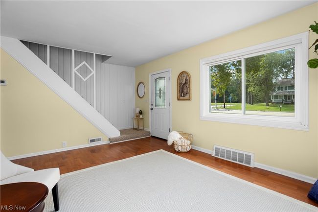 Sitting room featuring light hardwood floors | Image 13