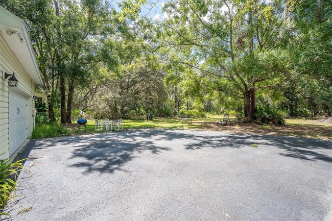 11933 Pasco Trails Blvd, House other with 4 bedrooms, 3 bathrooms and null parking in SPRING HILL FL | Image 35