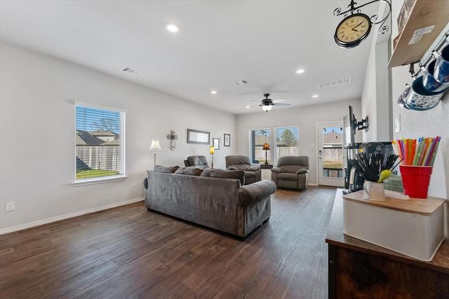 Spacious living with windows that brings in tons of natural light. | Image 13