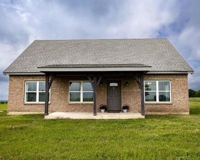 View of front of house featuring a front lawn | Image 1